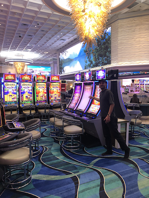 A man in a half-assed arabesque in a casino